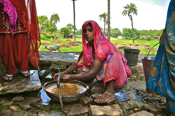 Village Woman Washing Grain Uttar Pradesh